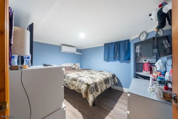 a bed sitting in a bedroom and desk