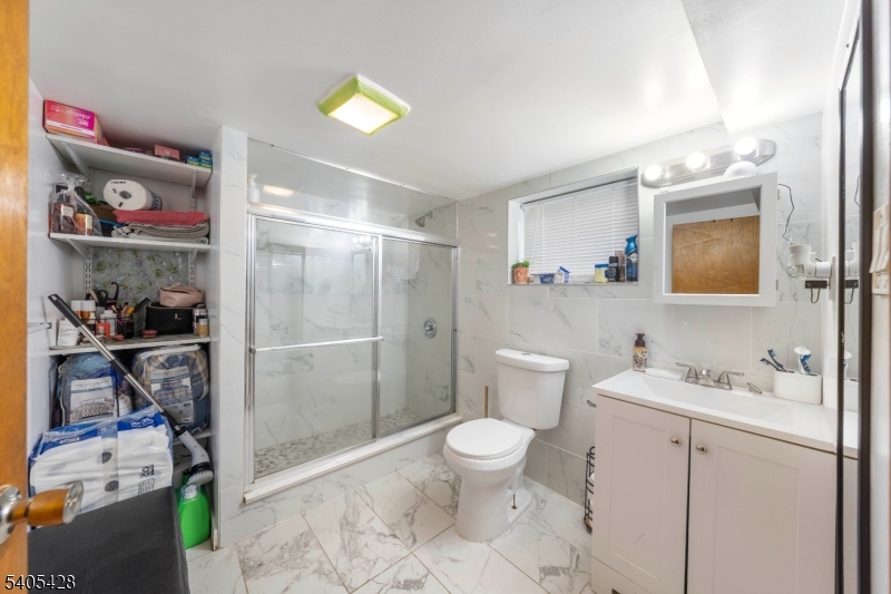 343 Dewitt Street Linden, NJ 07036 - Photo 22 of 33 a bathroom with a sink vanity granite and toilet