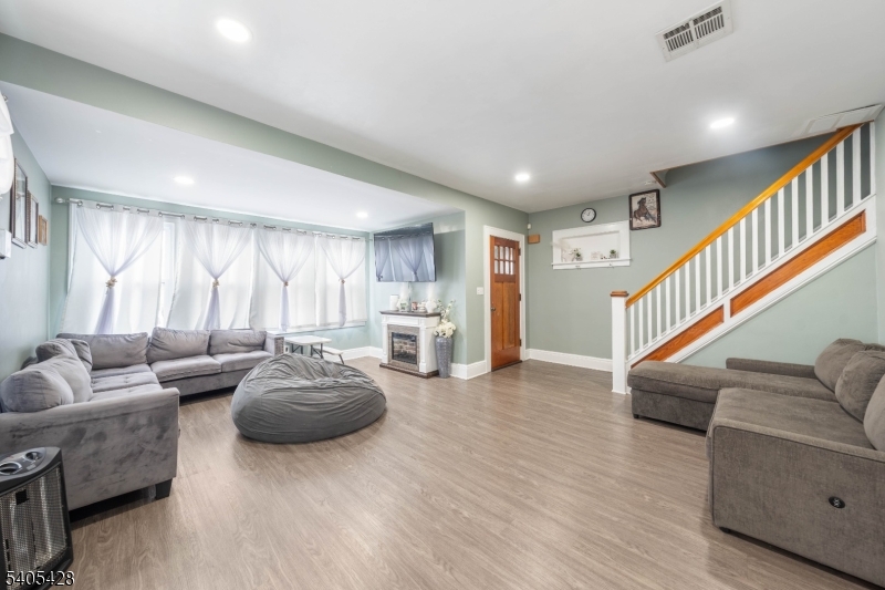 343 Dewitt Street Linden, NJ 07036 - Photo 6 of 33 a living room with furniture and a wooden floor