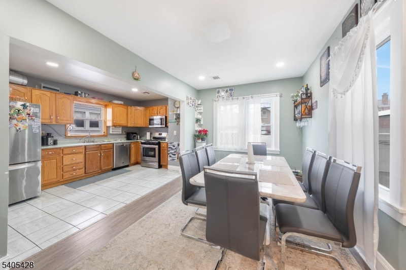 343 Dewitt Street Linden, NJ 07036 - Photo 7 of 33 a view of a dining room with furniture and a kitchen