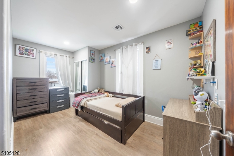 343 Dewitt Street Linden, NJ 07036 - Photo 10 of 33 a bedroom with a bed and furniture