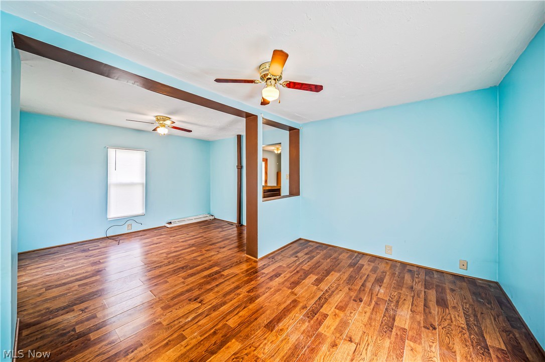 116 South Cedar Street Geneva, OH 44041 - Photo 26 of 35 Master Bedroom featuring ceiling fan and hardwood / wood-style flooring, half bath hookup