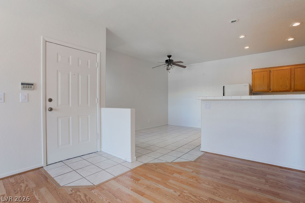 2201 Ramsgate Drive, Unit 326 Henderson, NV 89074 - Photo 16 of 44 Foyer featuring light tile patterned floors, ceiling fan, and recessed lighting