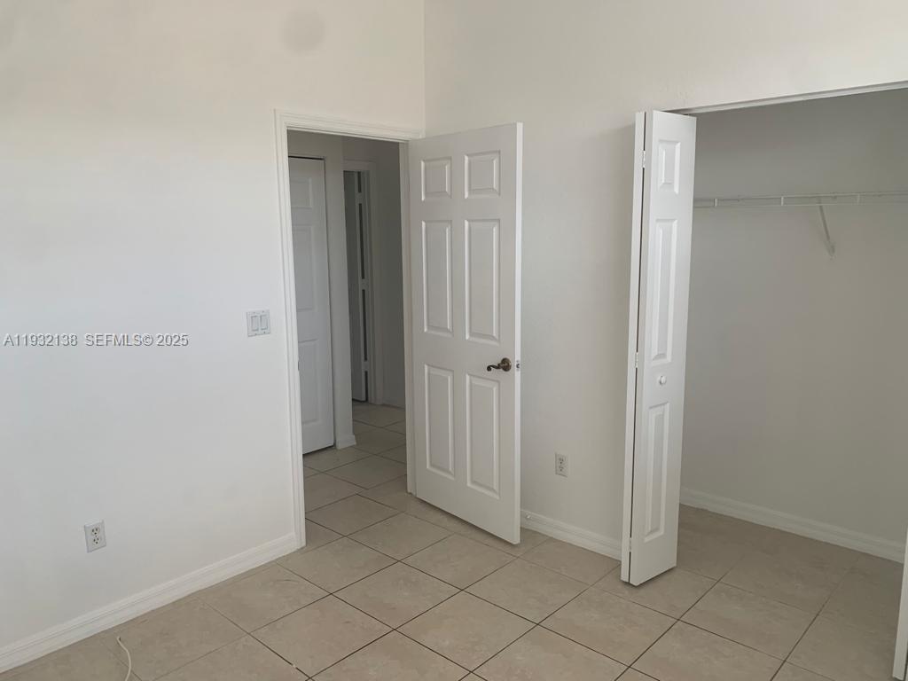 9070 Preston Place, Unit 9070 Tamarac, FL 33321 - Photo 15 of 16 a view of an empty room
