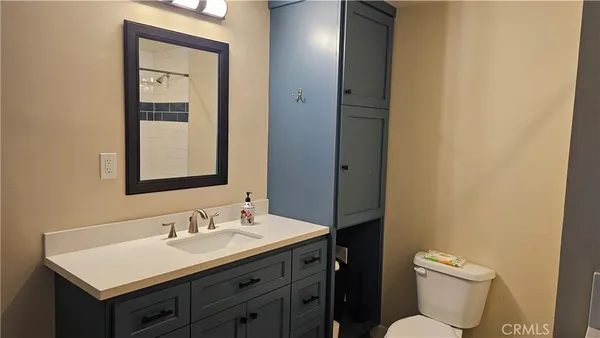 a view of a two chair in the back yard of the house