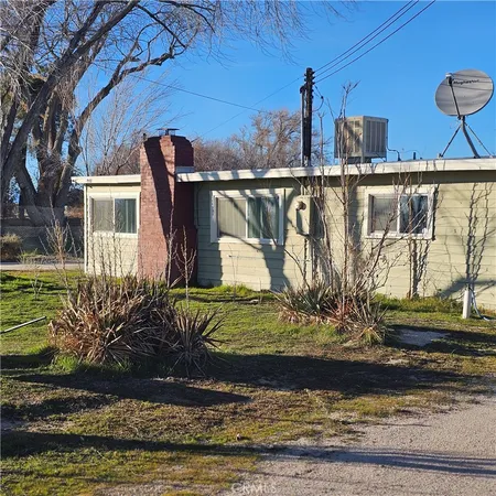 a view of a car park in front of house