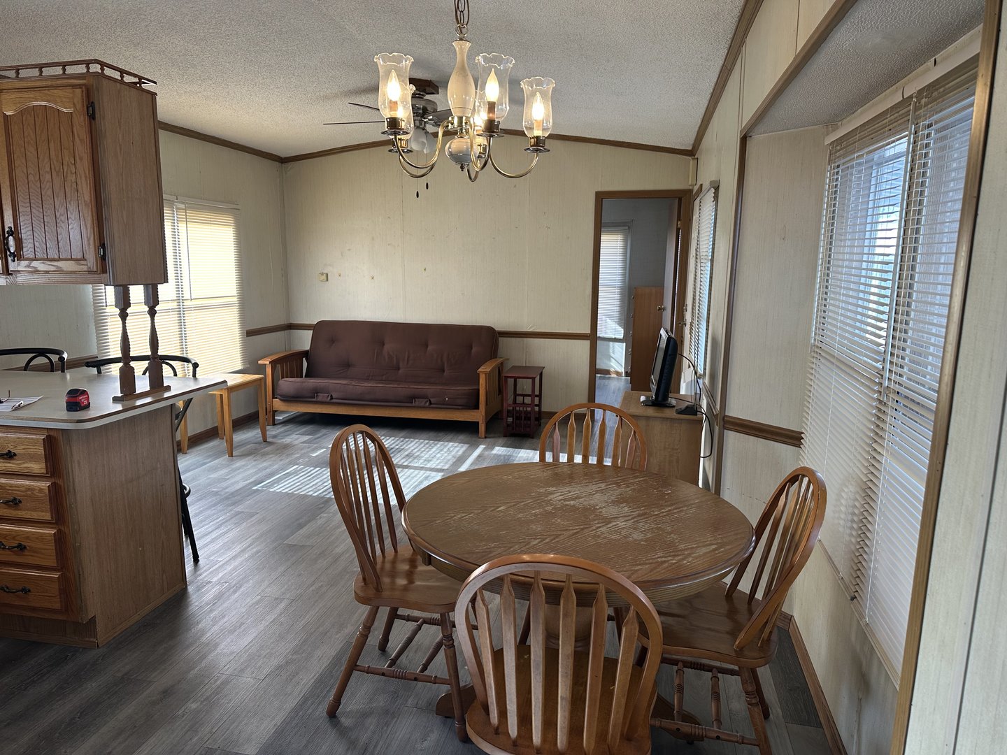 8800 South Harlem Avenue, Unit 1127 Bridgeview, IL 60455 - Photo 3 of 9 a view of a dining room with furniture and chandelier