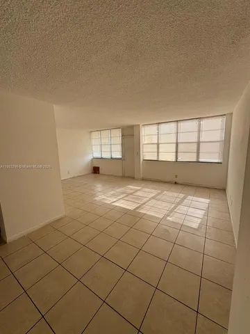 a view of empty room with windows