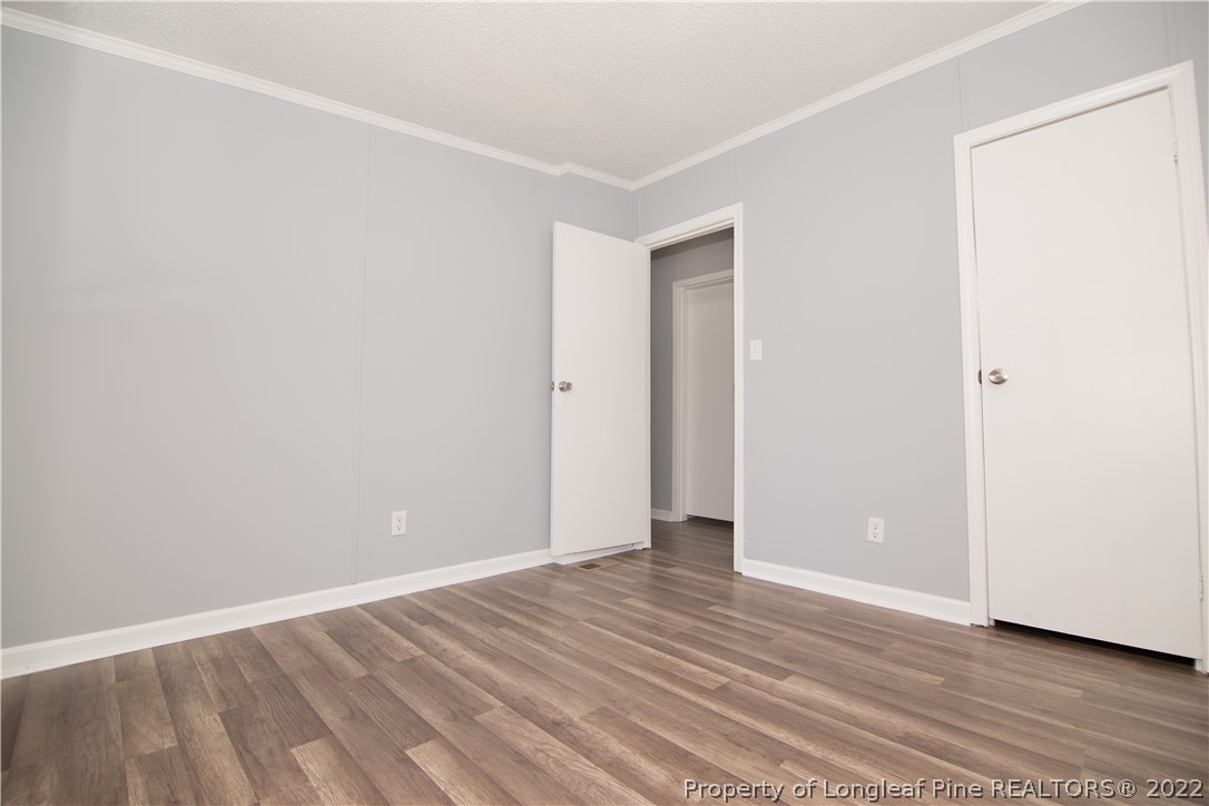 516 West Northpoint Road Spring Lake, NC 28390 - Photo 35 of 41 a view of an empty room with wooden floor