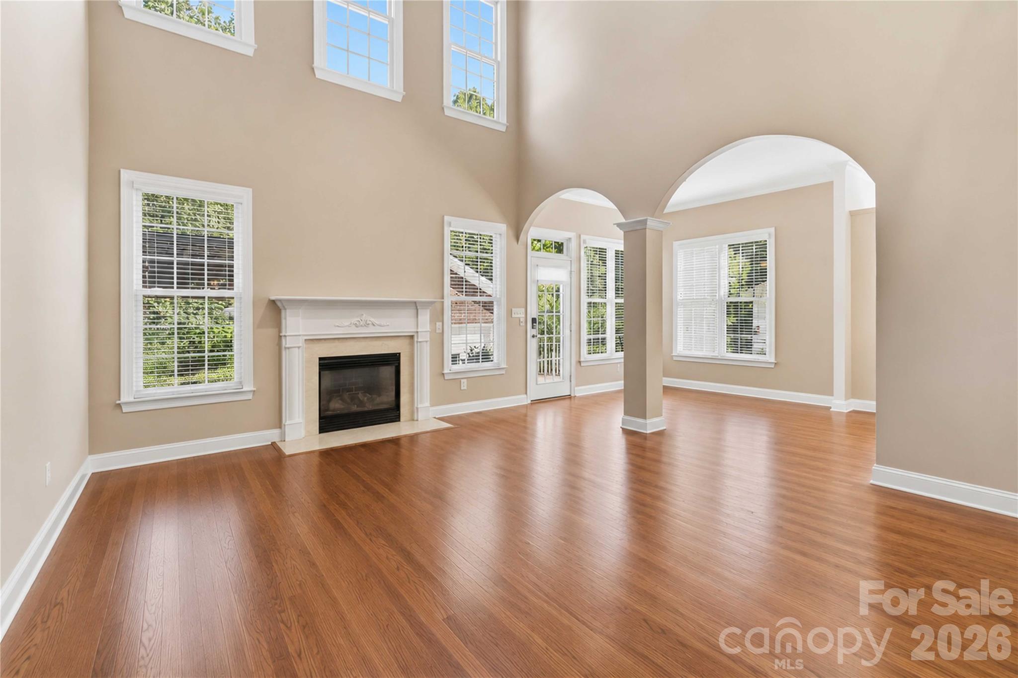 2436 Commons Court Fort Mill, SC 29708 - Photo 7 of 43 a view of an empty room with exposed radiator and fireplace