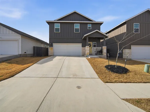 a view of a dining room with furniture and a window