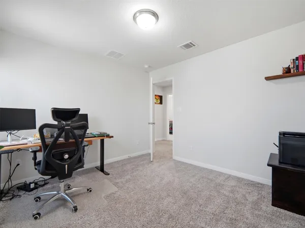 a view of a workspace with furniture