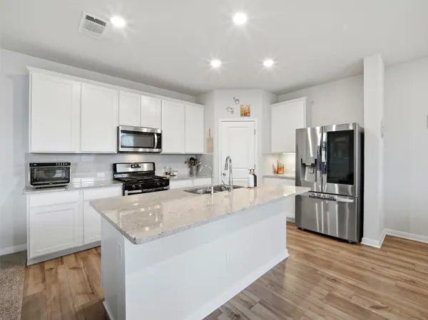 a living room with furniture and a rug