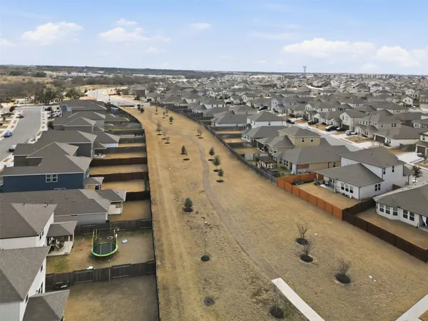 a kitchen with a sink a counter top space stainless steel appliances and cabinets