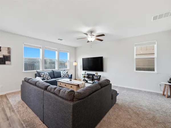 an aerial view of residential houses with outdoor space
