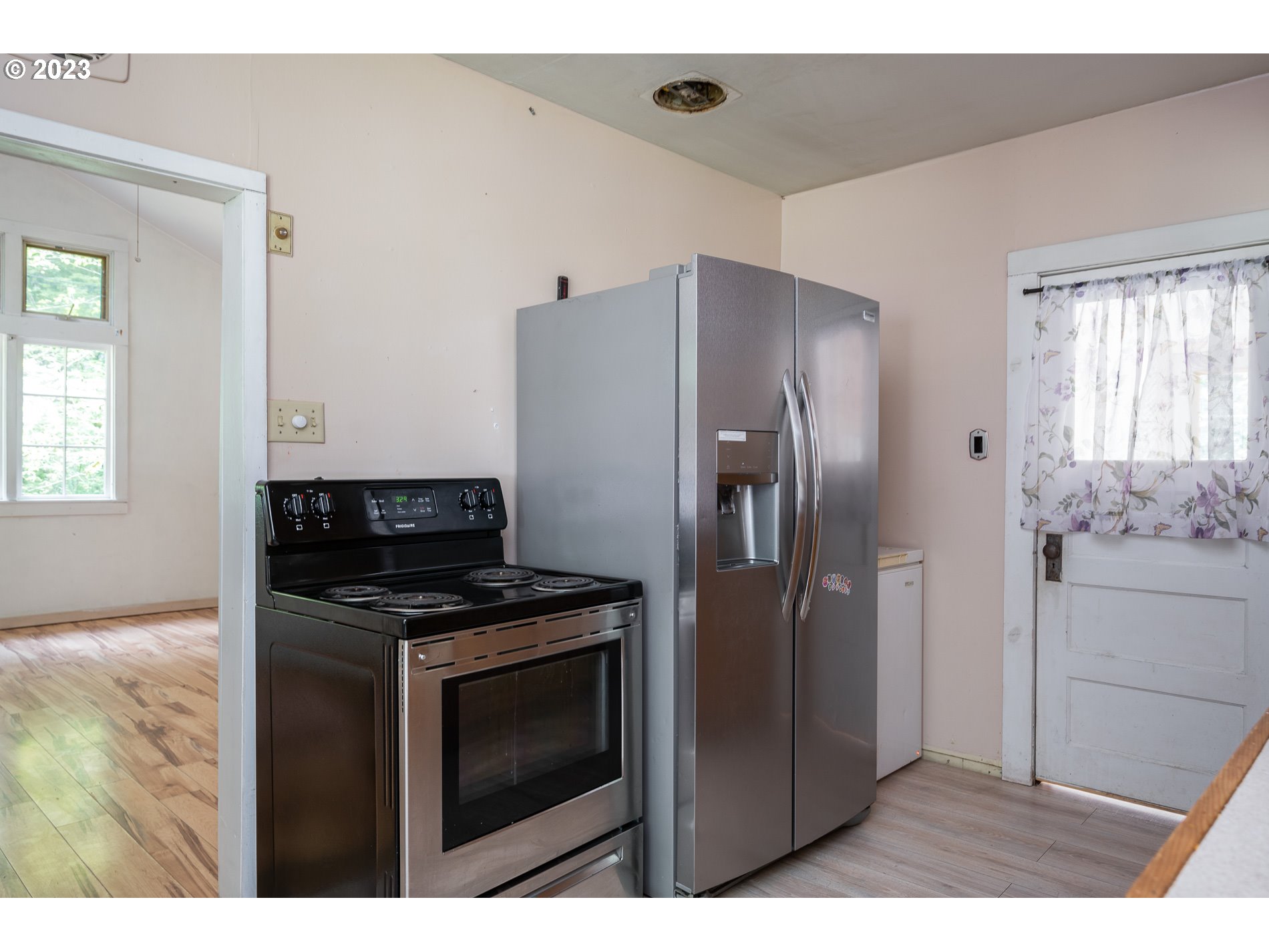 24995 East Old Smokey Road Rhododendron, OR 97049 - Photo 15 of 39 a kitchen with stainless steel appliances granite countertop a refrigerator and a stove