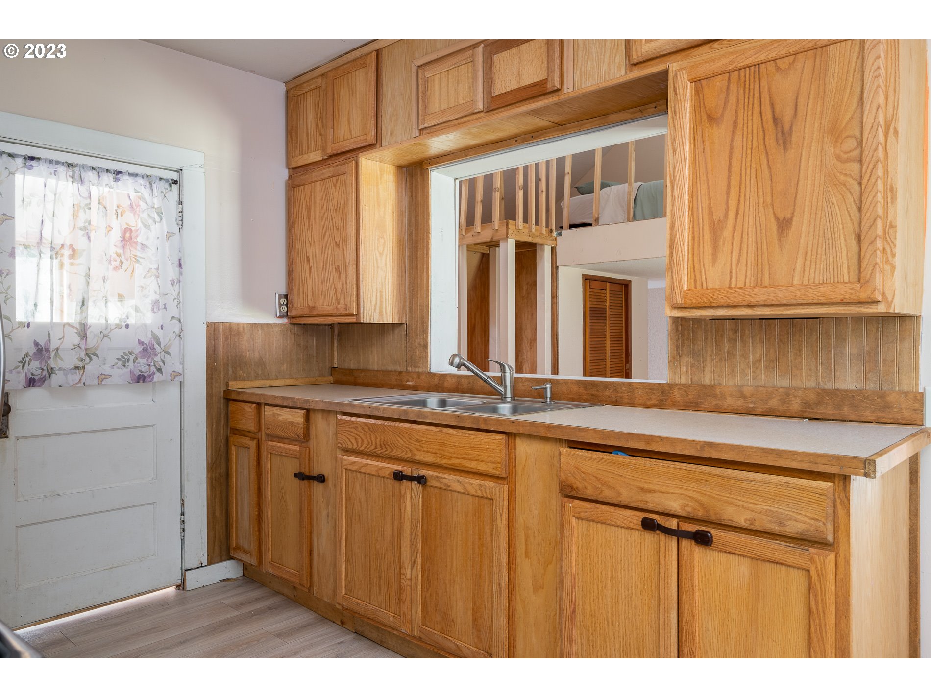 24995 East Old Smokey Road Rhododendron, OR 97049 - Photo 16 of 39 a kitchen with a sink and cabinets