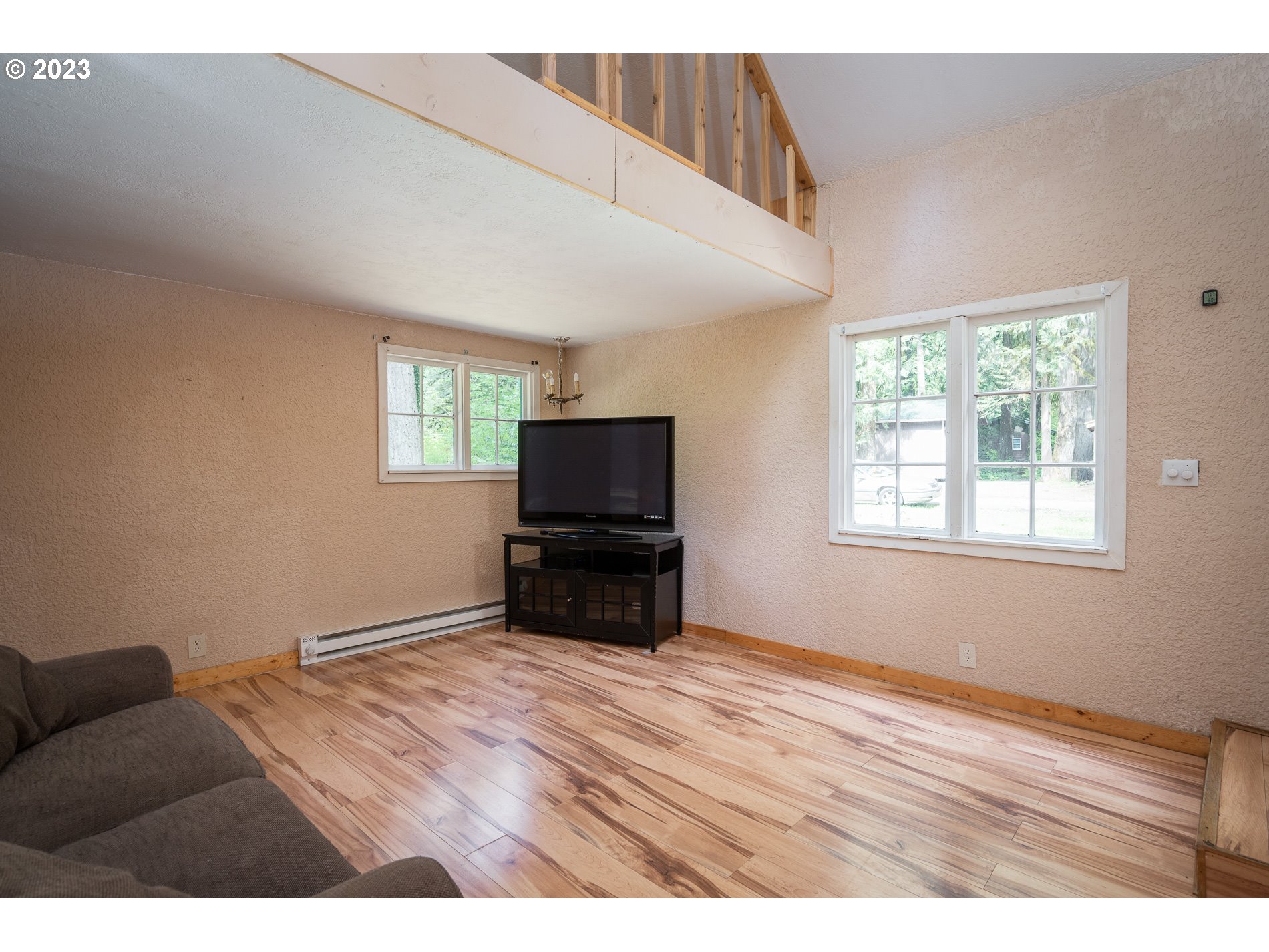 24995 East Old Smokey Road Rhododendron, OR 97049 - Photo 20 of 39 a living room with furniture and a flat screen tv