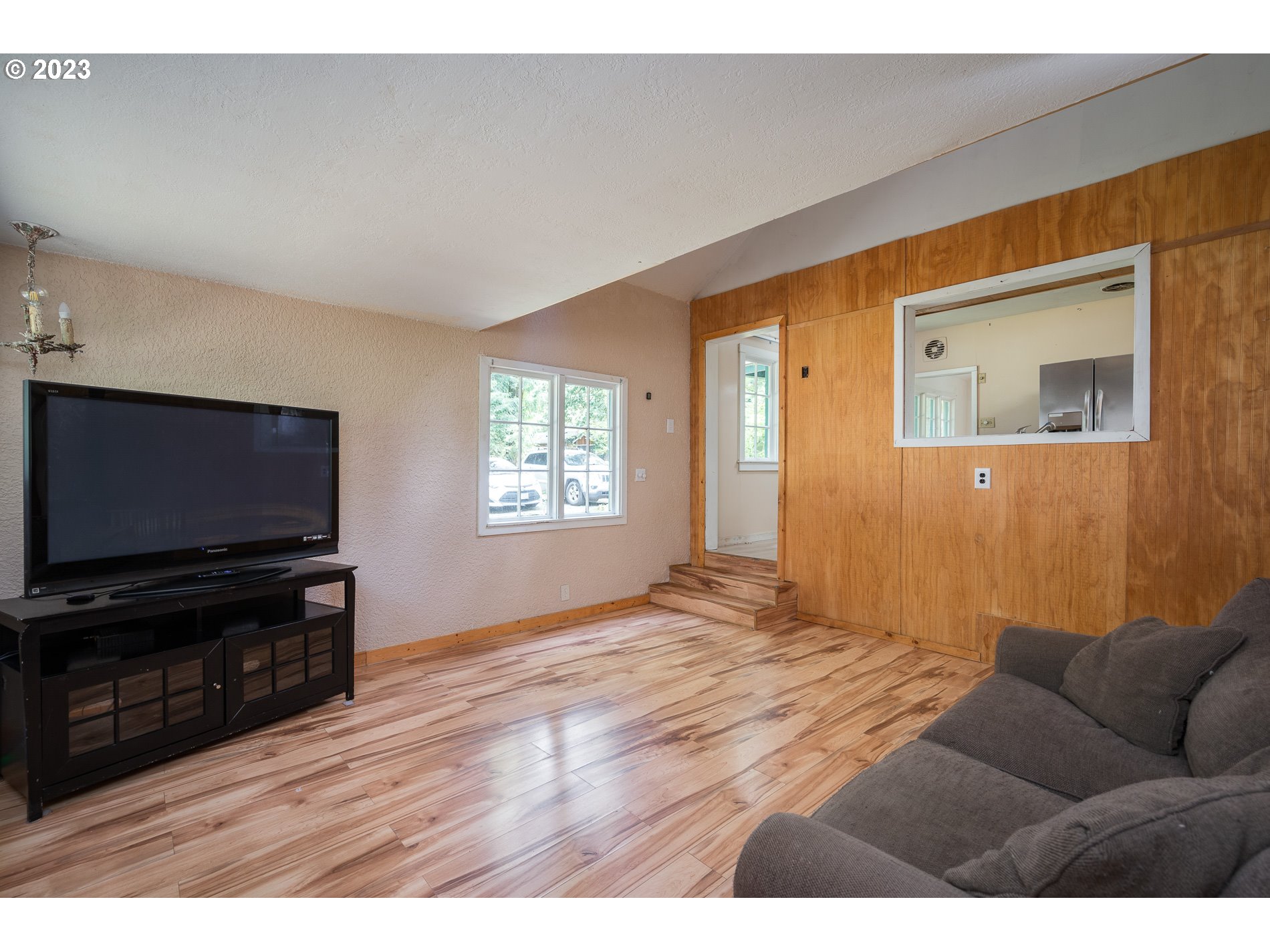 24995 East Old Smokey Road Rhododendron, OR 97049 - Photo 21 of 39 a living room with furniture and a flat screen tv