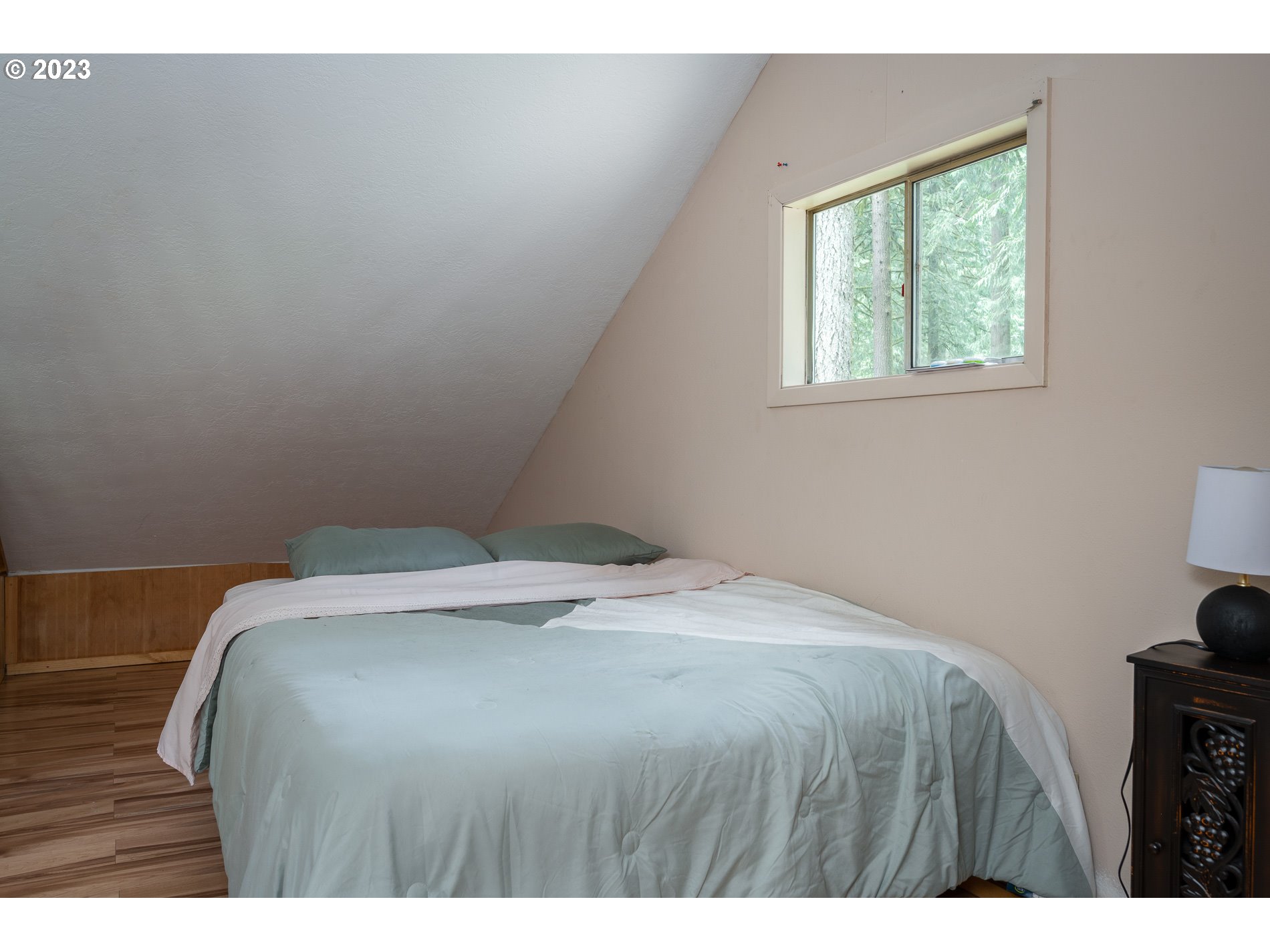 24995 East Old Smokey Road Rhododendron, OR 97049 - Photo 24 of 39 a bedroom with a bed and a window