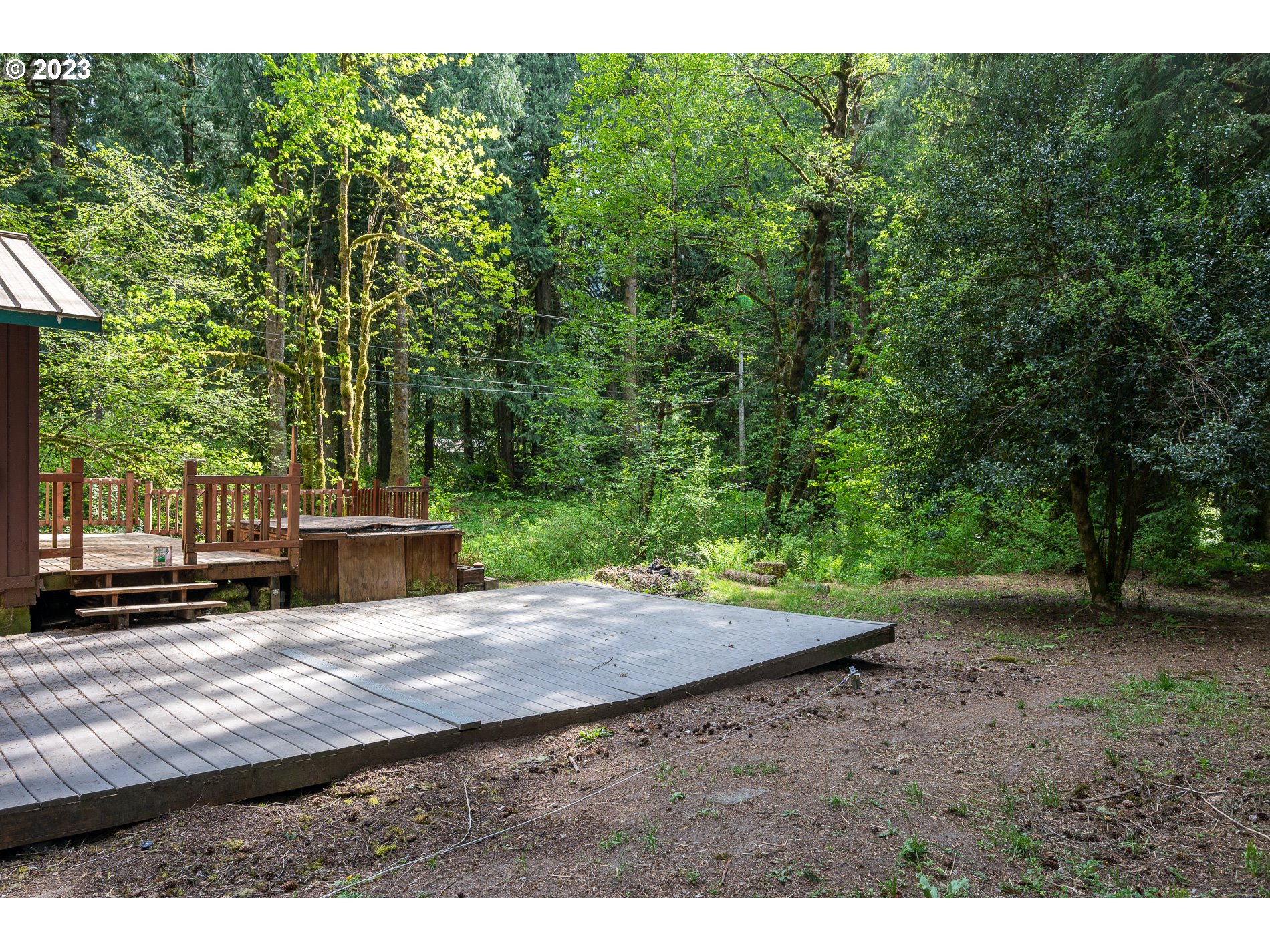 24995 East Old Smokey Road Rhododendron, OR 97049 - Photo 26 of 39 a view of a backyard with large trees