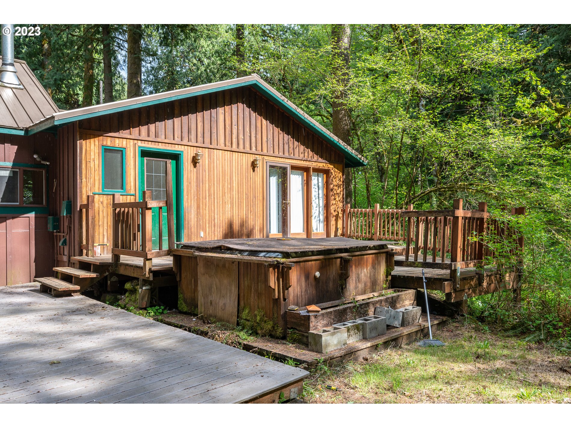 24995 East Old Smokey Road Rhododendron, OR 97049 - Photo 28 of 39 a view of a small house with backyard