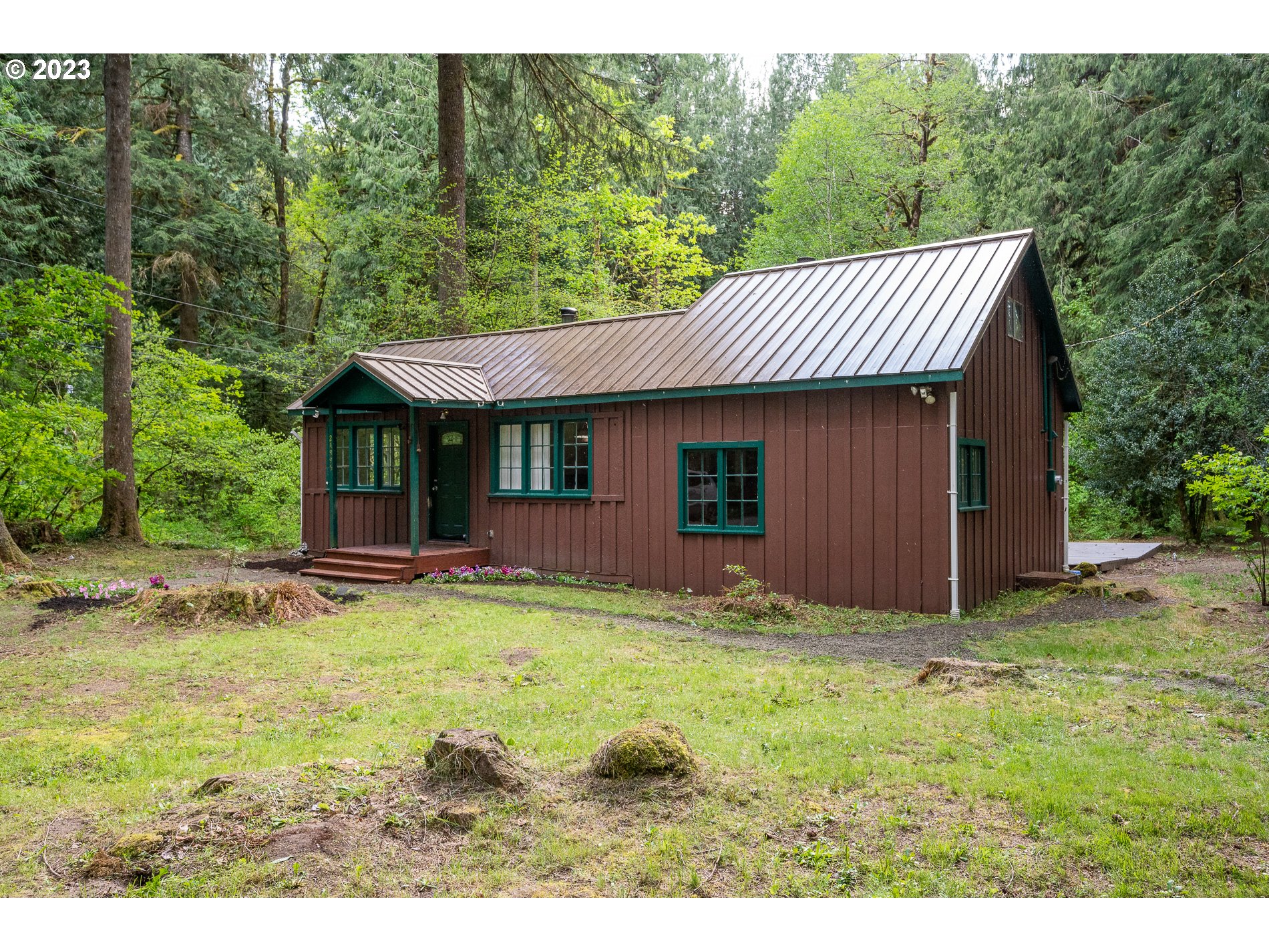 24995 East Old Smokey Road Rhododendron, OR 97049 - Photo 3 of 39 a view of a house with pool and a yard