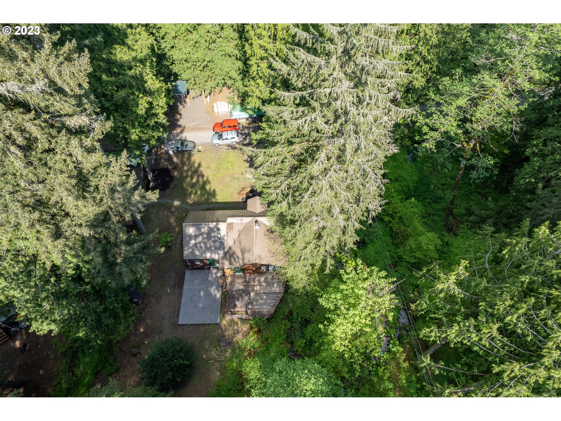 24995 East Old Smokey Road Rhododendron, OR 97049 - Photo 8 of 39 a backyard of a house with a yard and outdoor seating