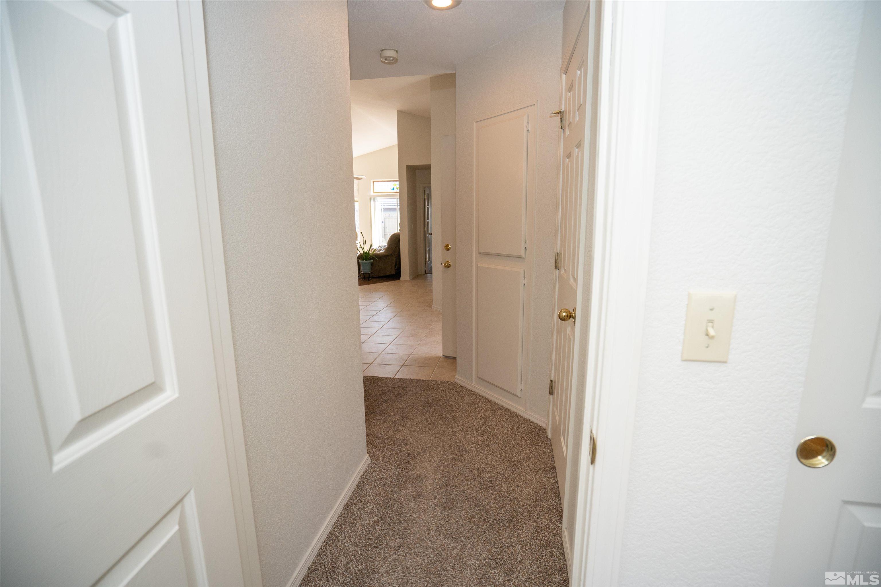 6346 Golden Creek Road Reno, NV 89519 - Photo 12 of 25 a view of a livingroom from a hallway