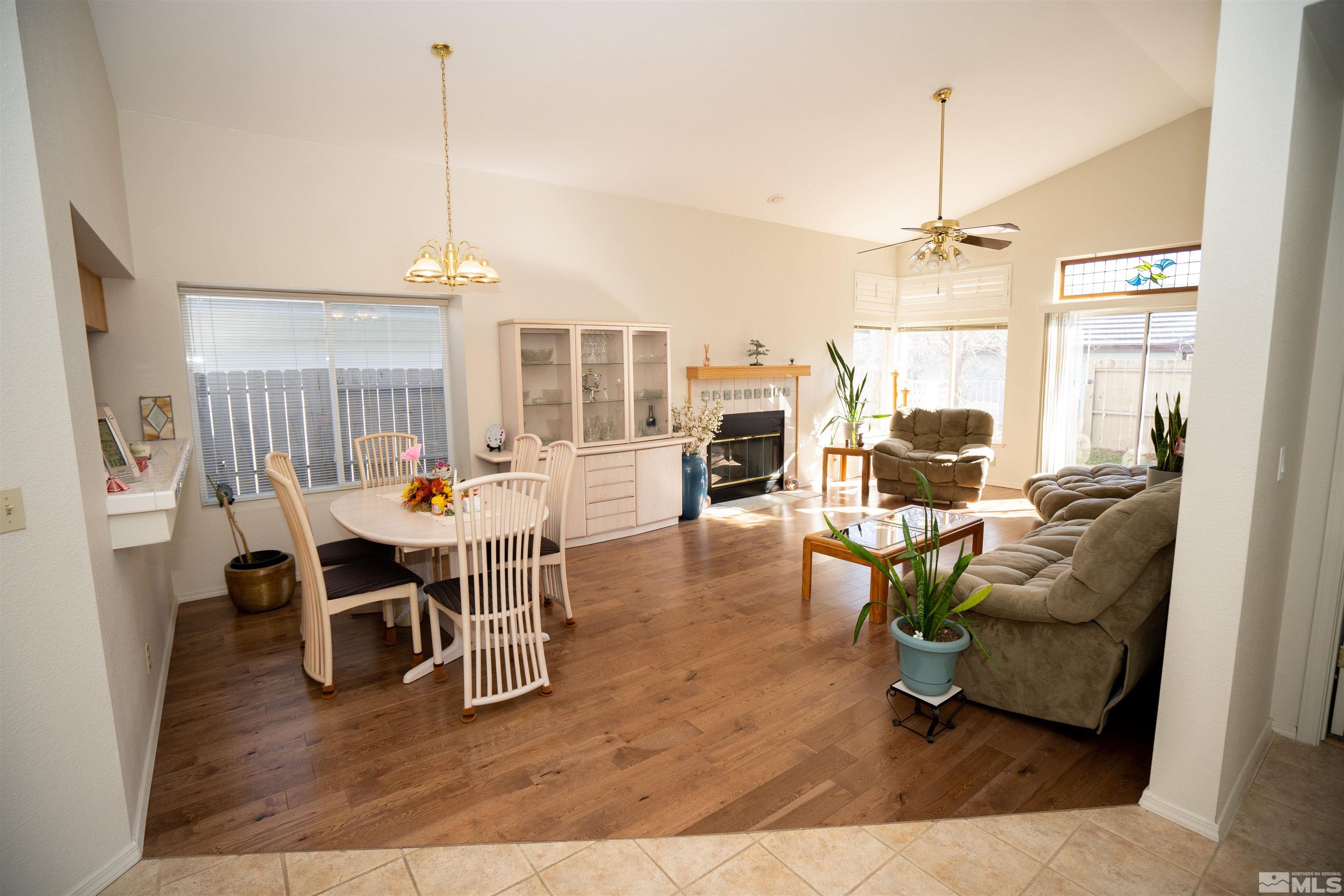 6346 Golden Creek Road Reno, NV 89519 - Photo 4 of 25 a living room with furniture wooden floor and a chandelier