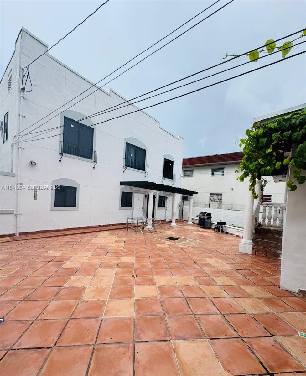 1238 Southwest 4th Street Miami, FL 33135 - Photo 16 of 27 a view of a house with a backyard