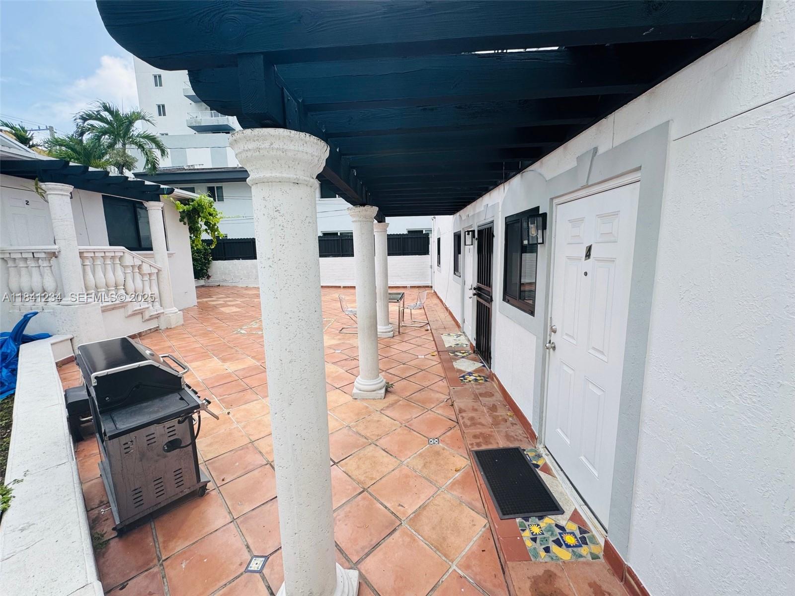 1238 Southwest 4th Street Miami, FL 33135 - Photo 18 of 27 a front view of a house with wooden floor