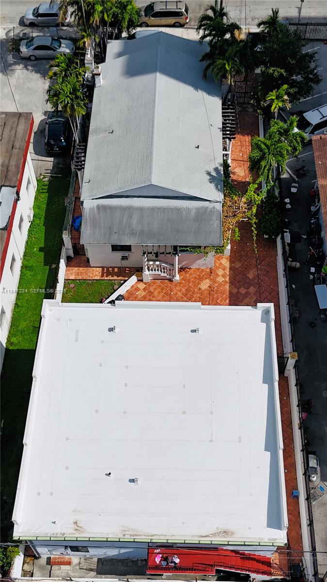 1238 Southwest 4th Street Miami, FL 33135 - Photo 6 of 27 an aerial view of a house with swimming pool and large trees