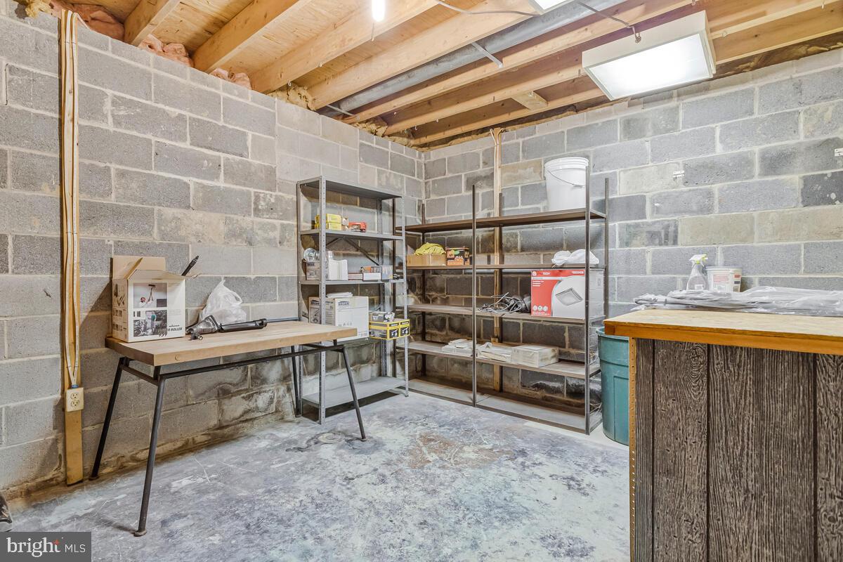 9638 Ridge View Drive North Beach, MD 20714 - Photo 39 of 53 Work space in the basement, perfect for projects