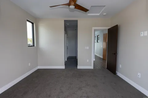 an empty room that has a window in it