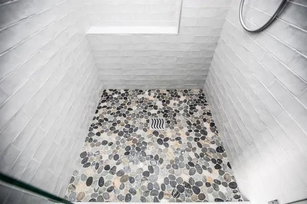 a bathroom with a bathtub and shower