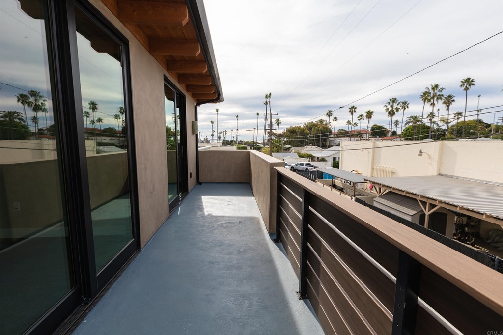 1136 South Coast Highway 101 Encinitas, CA 92024 - Photo 3 of 18 a kitchen with stainless steel appliances granite countertop a lot of cabinets
