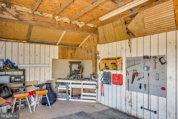 a view of a house with backyard and a garage