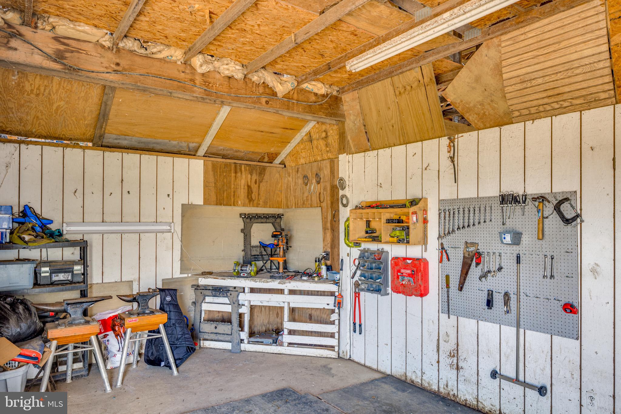 199 Bordentown Georgetown Road Chesterfield, NJ 08515 - Photo 39 of 47 a garage with table and chairs