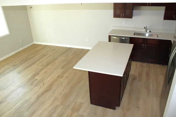 a kitchen with a sink and a refrigerator