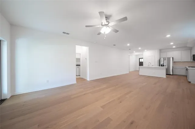 a view of a livingroom with a kitchen