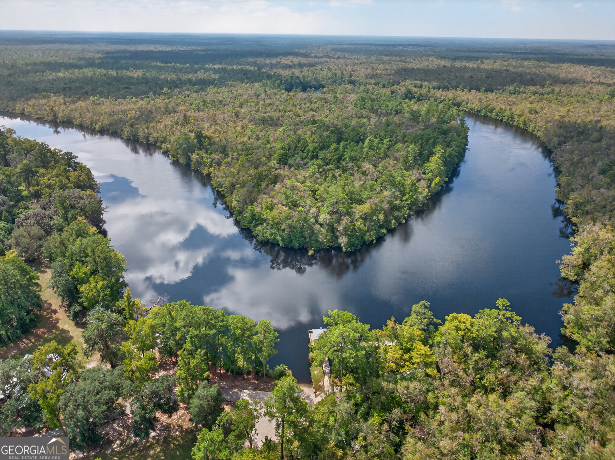 635 Breakwater Loop Kingsland, GA 31548 - Photo 11 of 26 a view of a lake with a yard