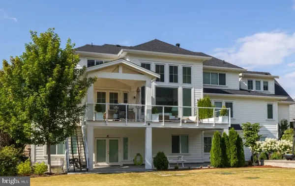 a front view of a building with garden