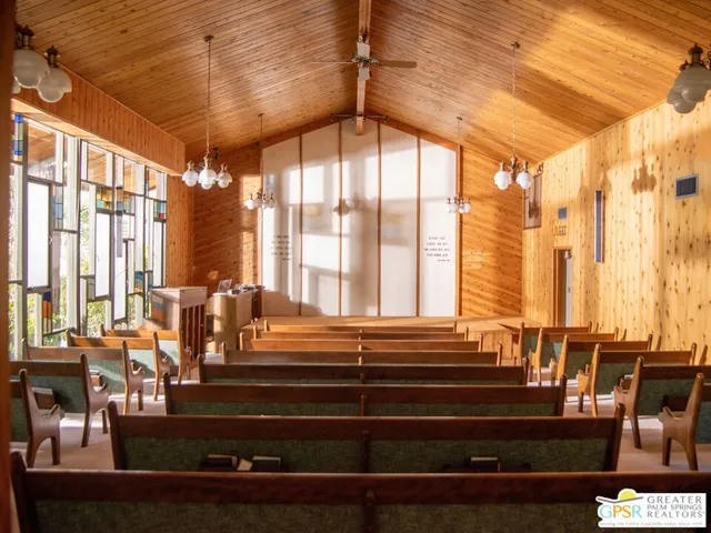 a living room with large windows