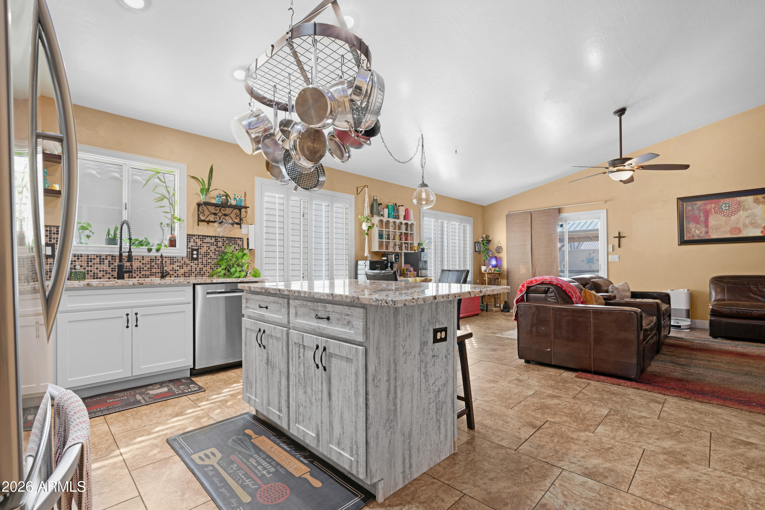 1513 West Shellfish Drive Gilbert, AZ 85233 - Photo 13 of 35 a kitchen with cabinets and window