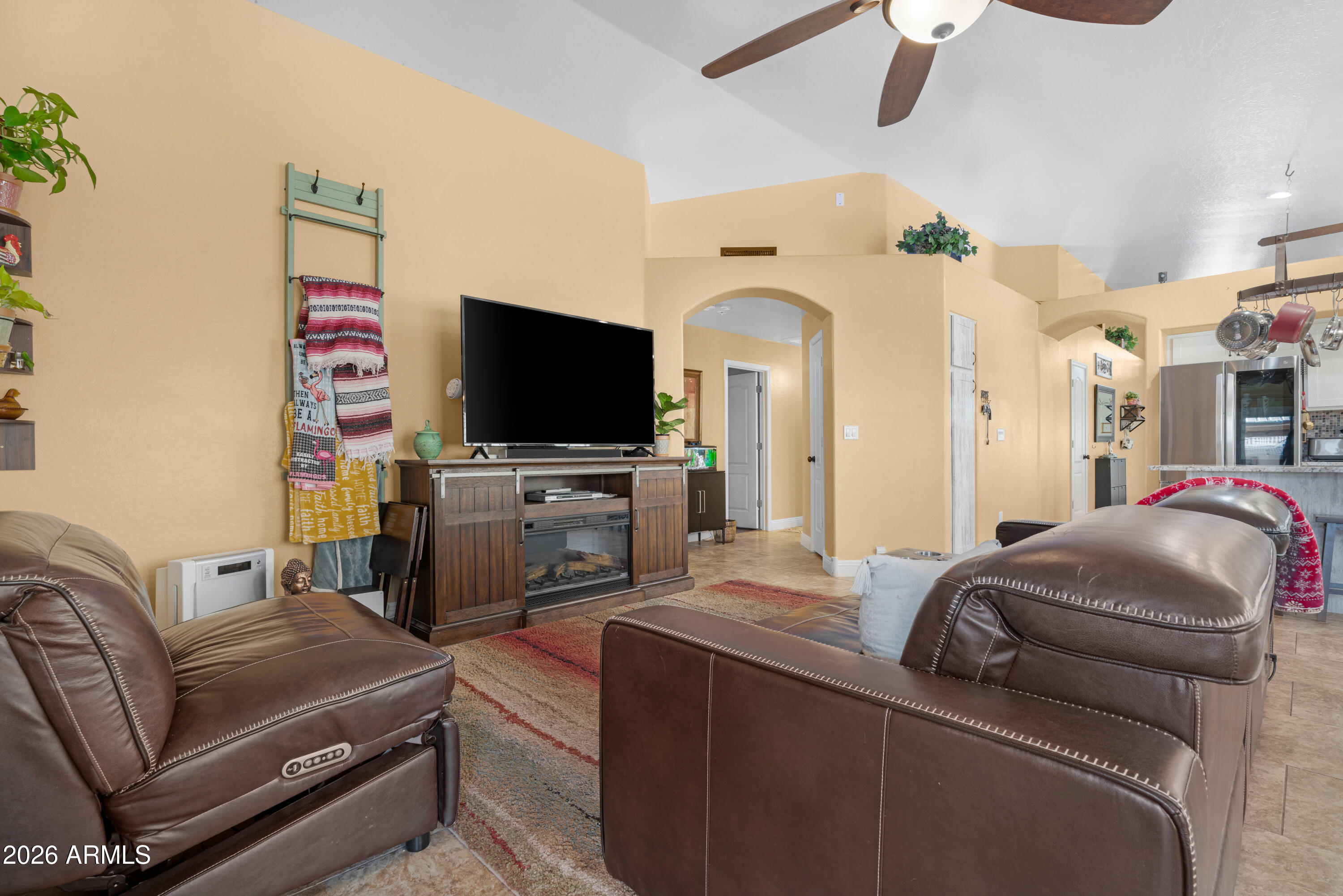 1513 West Shellfish Drive Gilbert, AZ 85233 - Photo 17 of 35 a living room with furniture and a flat screen tv