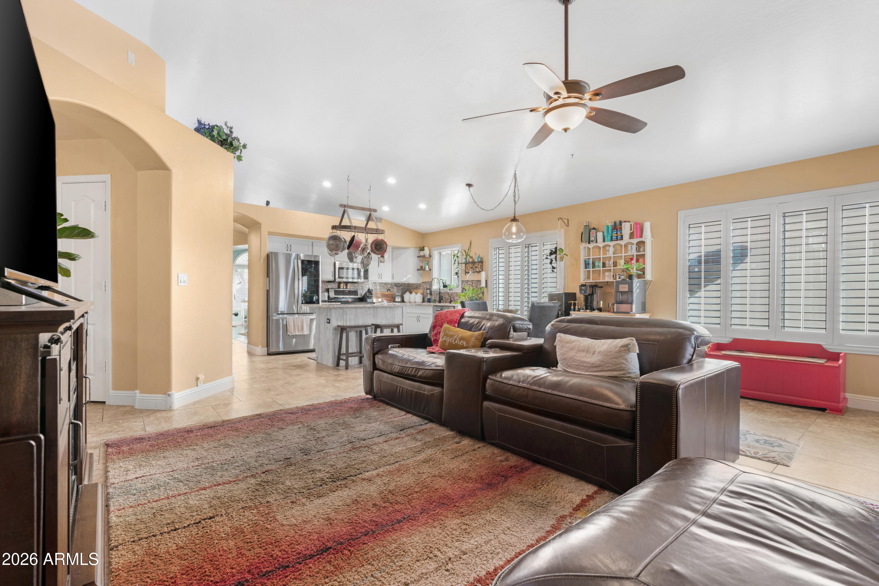 1513 West Shellfish Drive Gilbert, AZ 85233 - Photo 18 of 35 a living room with furniture and a flat screen tv