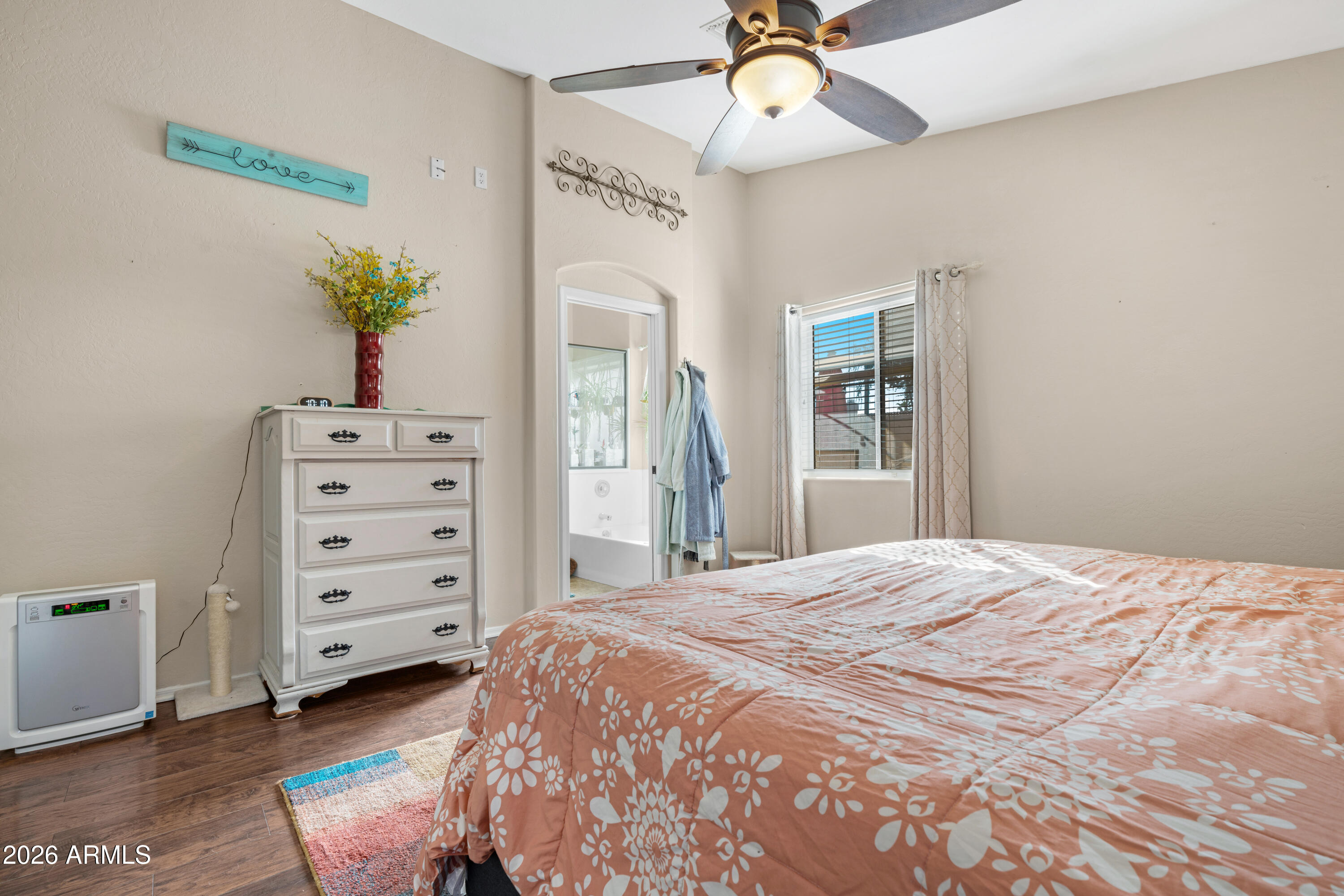 1513 West Shellfish Drive Gilbert, AZ 85233 - Photo 22 of 35 a bedroom with a bed and a chandelier