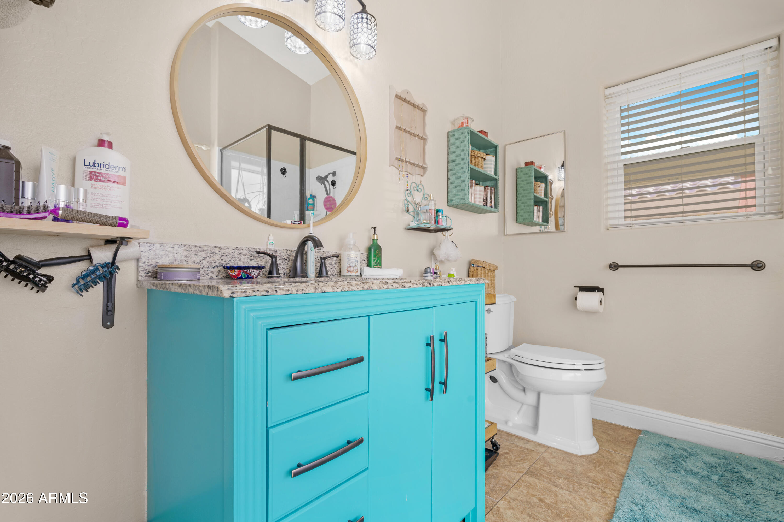 1513 West Shellfish Drive Gilbert, AZ 85233 - Photo 24 of 35 a bathroom with a toilet a sink and a mirror