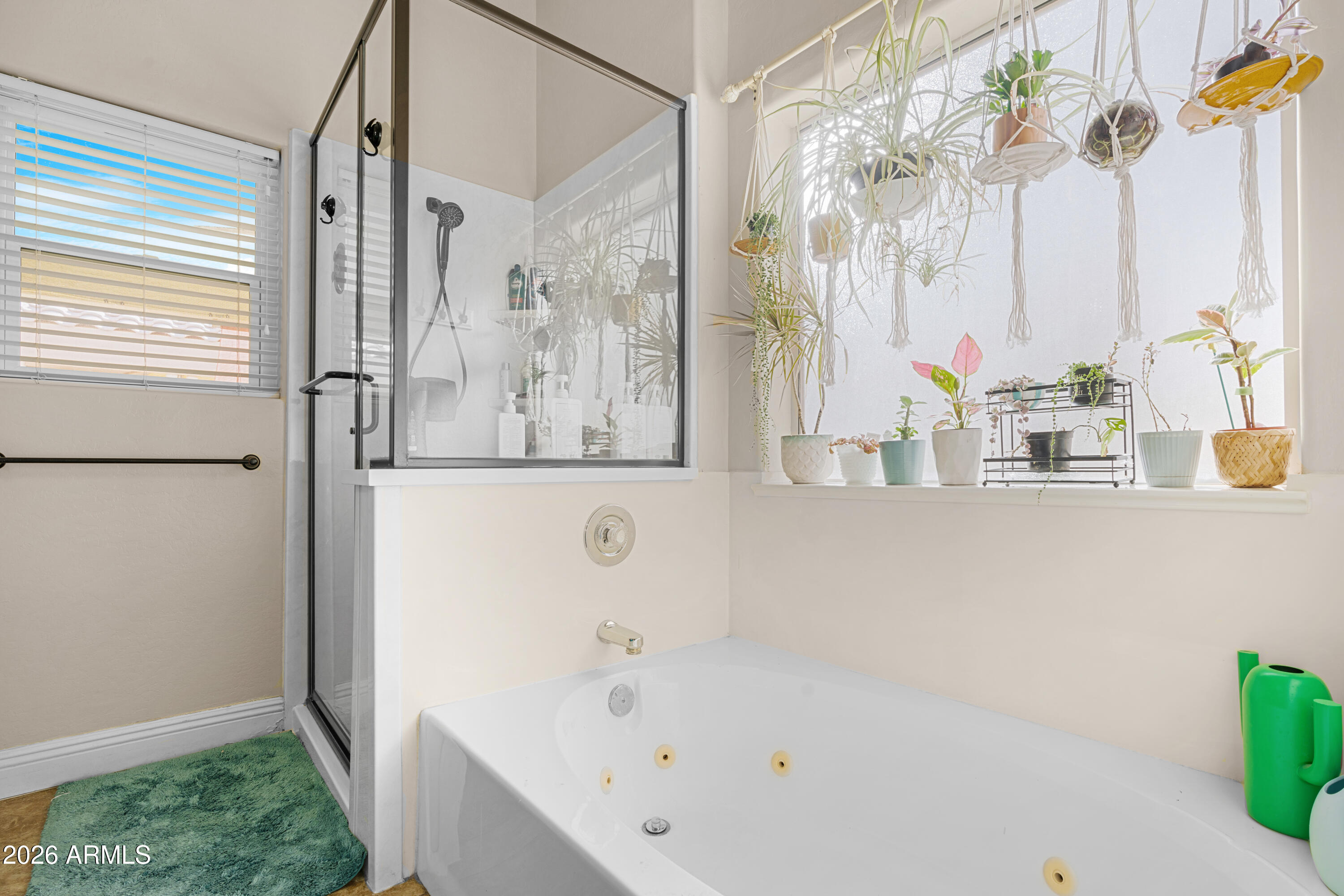 1513 West Shellfish Drive Gilbert, AZ 85233 - Photo 25 of 35 a bathroom with a bathtub and a shower
